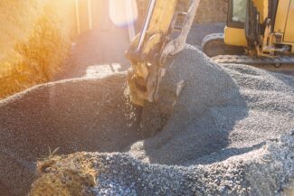 Loading of stone excavator works in a gravel pit